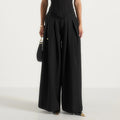 Black high waisted pleated wide leg trousers