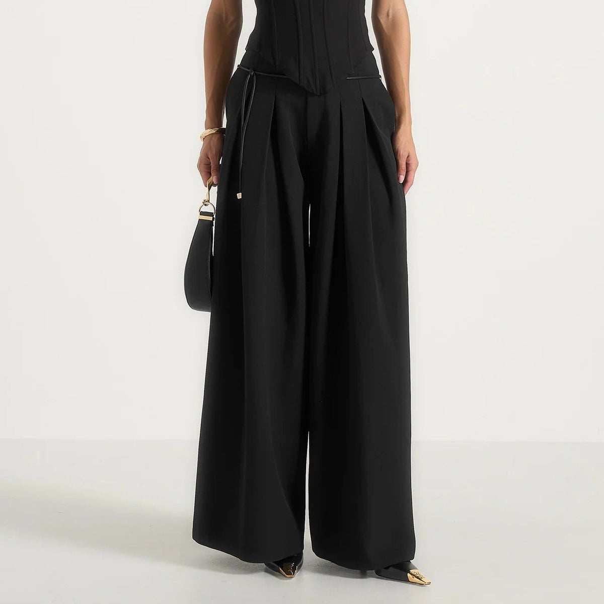 Black high waisted pleated wide leg trousers