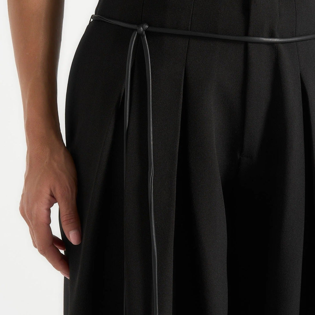 Black high waisted pleated wide leg trousers